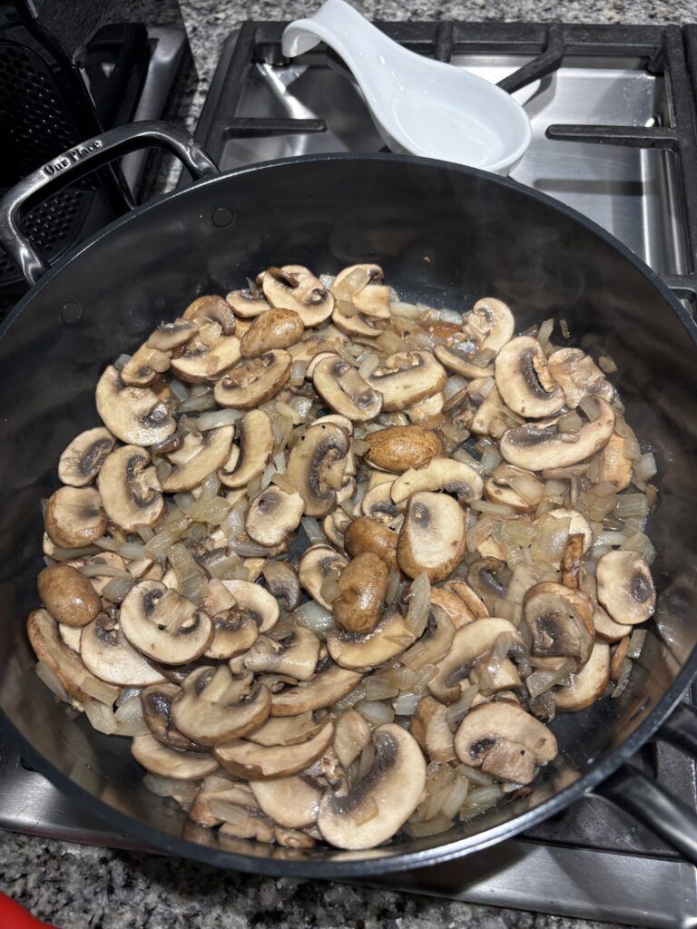 Mushrooms and onions cooking 