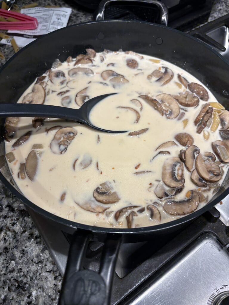 Mushrooms cooking with cream added
